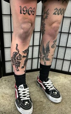 a person with tattoos on their legs