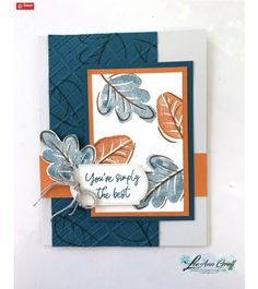 a close up of a greeting card with leaves on the front and an orange border around it