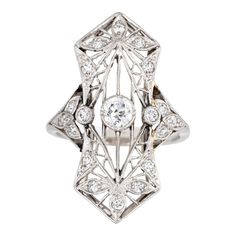 Finely detailed antique Edwardian ring (circa 1900s to 1910s) crafted in 900 platinum.   Centrally mounted estimated 0.25 carat old Mine cut diamond is accented with 18 x estimated 0.02 to 0.03 carat diamonds. The total diamond weight is estimated at 0.63 carats. The diamonds are estimated at H-I colour and SI1-2 clarity.   The ring features lacy filigree detail within an elongated shield mount, a hallmark of the Edwardian era. With a slight curved saddle the ring sits comfortably on the finger Edwardian Diamond Ring, Diamond Ring Platinum, Edwardian Ring, Antique Jewelry Rings, Old Mine Cut Diamond, Vintage Fine Jewelry, Platinum Ring, Diamond Cluster Ring, Lab Created Diamonds