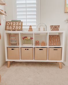 1. Kallax ikea shelf 
2. Amazon mid century legs 
3. Gathre medium sized bins Living Room Kids Toy Storage, Toy Organization For Living Room, Toy Storage For Nursery, Livingroom Toy Storage, Toddler Storage Ideas Toy Organization, Toy Room Cube Storage, Storage Toys Ideas, Toddler Baby Girl Room, Toy Storage Kids Bedroom