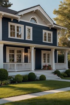 a blue house with white trim and windows