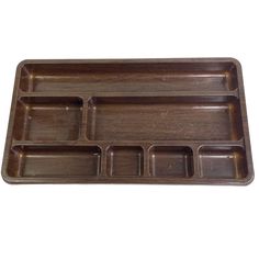 a wooden tray with compartments on it