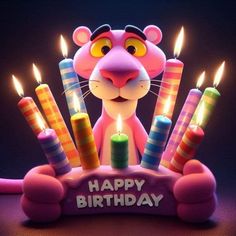 a birthday cake with candles in the shape of a mouse and an image of a rat