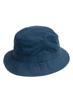 A breathable, but wind and water repellent accessory that quickly becomes both a rainy day and beach trip essential. Ventile is a premiere performance fabric. This Bucket Hat stays in stock each Spring-Summer for that exact reason. Available in Indigo and Olive for SS22 - with a few units in Navy still straggling from season’s past. Ventile fabric is woven in Switzerland from American grown and spun extra long staple (ESL) cotton, and the tightness of the weave makes it totally water repellent. Casual Waterproof Solid Color Sun Hat, Casual Waterproof Bucket Hat For Travel, Casual Waterproof Sun Hat For Travel, Casual Waterproof Sun Hat, Waterproof Casual Travel Hats, Casual Waterproof Hats For Travel, Casual Waterproof Travel Hat, Casual Waterproof Sun Hat With Short Brim, Casual Waterproof Sun Hat With Curved Brim