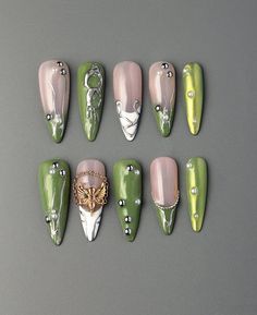 ❤Handmade❤ ❤Unique❤ ❤Reusable❤ ❤Hello, dear. Greetings and welcome to my store. Hope you find a style you like❤ ❤About Product❤ This is an exquisite handmade nail design. The green base color gives a fresh and natural feel, while also appearing stylish. The long stiletto shape is elegant and extends the lines of the fingers, making the hands look more slender. The silver stripes contrast with the green base, adding a sense of luxury and sophistication. This nail design presents a fashionable and Green Nail Gel, Emerald Green Y2k Nails, Press On Nails Green, Press On Nails With Charms, Green Fairy Nails, Fake Nails Summer, Green Nails Fairycore, Stiletto French Tip, Green Claw Nails