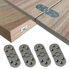 four pieces of wood with metal hardware on the bottom and two sets of screws in front