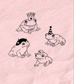 four frogs wearing party hats on top of each other