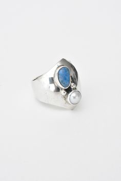 This ring is a stunner. We are always on the lookout for NAKAI pieces and finding this was exciting. A gorgeous example of NAKAI work, sterling silver adjustable ring with a gorgeous set pearl and lapis stone. One of a kind. All of our vintage items are cleaned by hand with a polishing cloth. Our aim is to clean, but not to look new. The markings and wear you see adds to the value to this vintage piece. This is a vintage previously owned ring. Therefore, light wear can be expected. .925 silver, size 7 (adjustable) *Please read our Jewelry Care Guide Vintage Pearls, Adjustable Rings, Jewelry Care, Amazing Jewelry, 925 Silver, Vintage House, That Look, Vintage Items, Sterling Silver