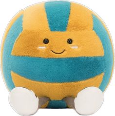 a yellow and blue stuffed animal sitting on top of a white surface with one eye open