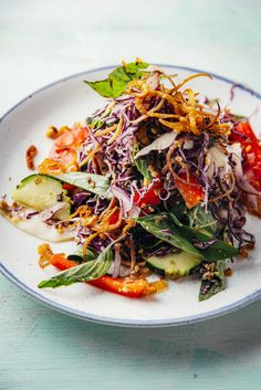 a white plate topped with lots of veggies