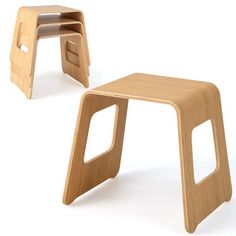 two wooden stools sitting next to each other on a white surface with no one around them