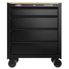 a black cart with four drawers on wheels