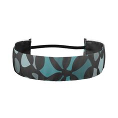 a black and blue headband with an abstract design on the front, side view