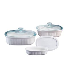 three white casserole dishes with lids