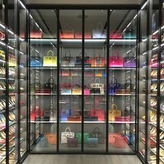 a display case filled with lots of colorful bags