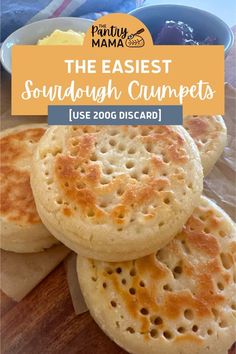 some breads are stacked on top of each other with the words, the easyest sourdough crumpets