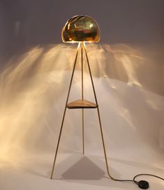 a lamp that is on top of a stand