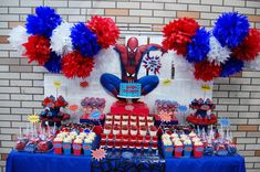 a table topped with red, white and blue cupcakes