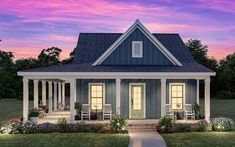 a small blue house with porches and columns on the front lawn at sunset or dawn