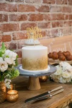 a white cake sitting on top of a wooden table