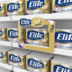 several rows of toilet paper on shelves in a grocery store, each labeled with the word'eite '