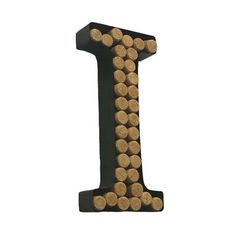 the letter i made out of wine corks is black and has brown letters on it