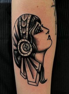 a black and white tattoo with a woman's head in an egyptian style design