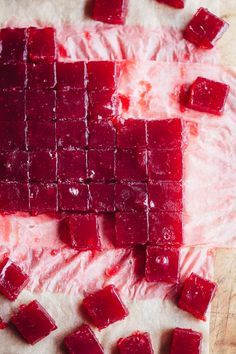 cubes of jelly sit on top of wax paper