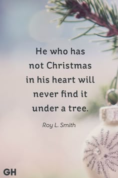 a christmas ornament hanging from a tree branch with a quote about he who has not christmas in his heart will never find it under a tree