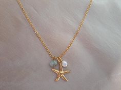 Gold Starfish Necklace Gold Crystal Star Necklace Gold layering Necklace Gold Plate Stainless Steel Necklace with Baby Pearl and Real Aquamarine  This Gold Necklace features a Beautiful 18K Gold Plate Starfish. The Starfish has textured detail on both sides The chain is Stainless Steel, strong durable and fade and tarnish resistant. You can have it with a baby Fresh Water Pearl or with a genuine Aquamarine Rondelle or with all the charms Great for someone with sensitive skin. Please choose your Starfish Necklace Gold, Accessory Inspo, Shark Tattoos, Star Necklace Gold, Baby Pearls, Starfish Necklace, Inspired Necklace, Blue Pendant, Crystal Stars