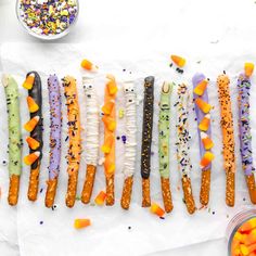 there are many candy sticks that have been made to look like carrots and sprinkles