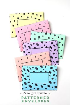 four different colored envelopes with black dots on them and the text free printable pattern envelope