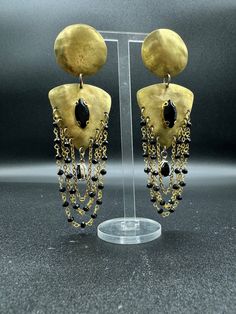 Baroque Handcrafted Earrings: Unique Elegance in Hand-pierced Brass, Steel Hook, and Black Crystals. Discover Our Distinctive Style - Etsy Handmade Black Brass Jewelry, Bronze Metal Jewelry For Evening, Bohemian Dangle Earrings For Evening, Gold Fusion Dangle Chandelier Earrings, Modern Brass Earrings For Evening, Elegant Oxidized Metal Danglers, Handmade Black Dangle Clip-on Earrings, Gold Dangling Beads Earrings For Evening, Gold Onyx Earrings For Evening