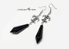 "These earrings are inspired by the Black Lady Crystal earrings from Sailor Moon!  The earrings are perfect for Sailor Moon cosplayer or Sailor Moon enthusiast. The black 'crystals' are acrylic on a silver plated finding, it is somewhat heavy and measures about 5cm. Purchase with the black lady necklace for additional discount.  E w/sterling S. Hook Options means the earring hook is a .925 sterling silver earring hook, all other components are still silver plated.  The earrings are sold \"as is\ Sailor Moon Black Lady, Sailor Moon Black, Sailor Moon Jewelry, Lady Necklace, Moon Accessories, Moon Kingdom, Pretty Jewelry Necklaces, Moon Black, Black Lady