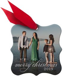 a christmas ornament with an image of three people holding hands and the words merry christmas