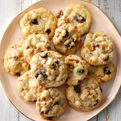 cranberry pecan cookies on a plate with the words cranberry pecan cookies