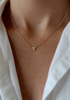 14k gold 16" Chain (6) 1mm white diamond Dimensions: 5.75mm The triangle that points downward is one of the oldest symbols of the divine power of the female. It can symbolize Love, Truth, and Wisdom Danty Necklace, Sterling Silver Leaf Necklace, Dainty Chain Necklace, Delicate Necklaces, Diamond Choker Necklace, Pave Necklace, Simple Chain, Gold Letter Necklace, Crown Necklace