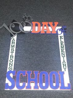 this is an image of a school day sign on the floor in front of a door