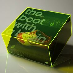 a green box with the words the book with fruit on it sitting on a table