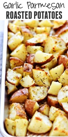 garlic parmesan roasted potatoes in a baking pan with text overlay that reads garlic parmesan roasted potatoes