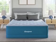 the beautyrest mattress is in front of two nightstands with lamps on either side