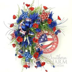 the wreath is decorated with red, white and blue flowers