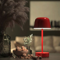 a red lamp sitting on top of a table