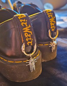 Boot charms with a silver coloured fly charm  The o ring is a carabiner type  There are 2 sets available  Would look perfect on docs or any boots Shoe Charms Doc Martens, Doc Marten Charms, Boot Charms, Fly Boots, Gothic Boots, Creative Shoes, Ring Der O, Boot Accessories, Shoe Clips