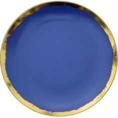 a blue plate with gold trim on the rim is shown in front of a white background