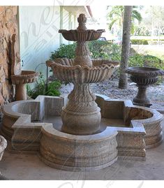 an outdoor fountain with three fountains in it