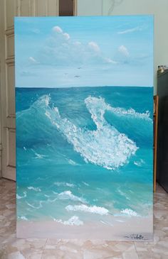 an oil painting of a wave in the ocean on a tile floor next to a door