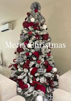 a christmas tree decorated with red and white ornaments