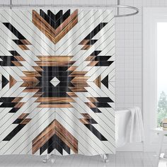 a bathroom with a shower curtain that has an abstract design on the front and back