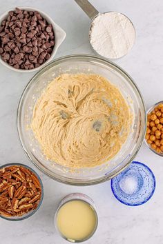 the ingredients to make chocolate pecan pie are in bowls and ready to be mixed together